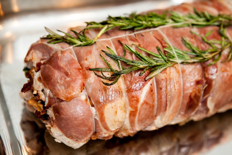 Prosciutto- wrapped pork loin. 
