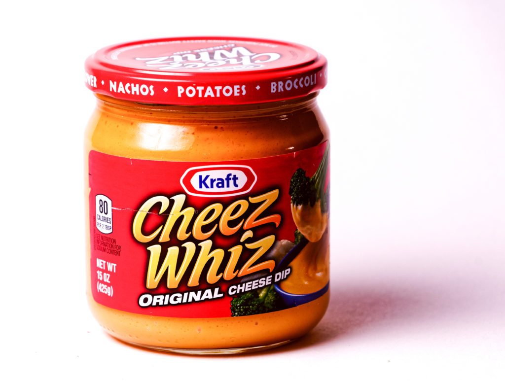 Cheez Whiz cheese spread and topping.