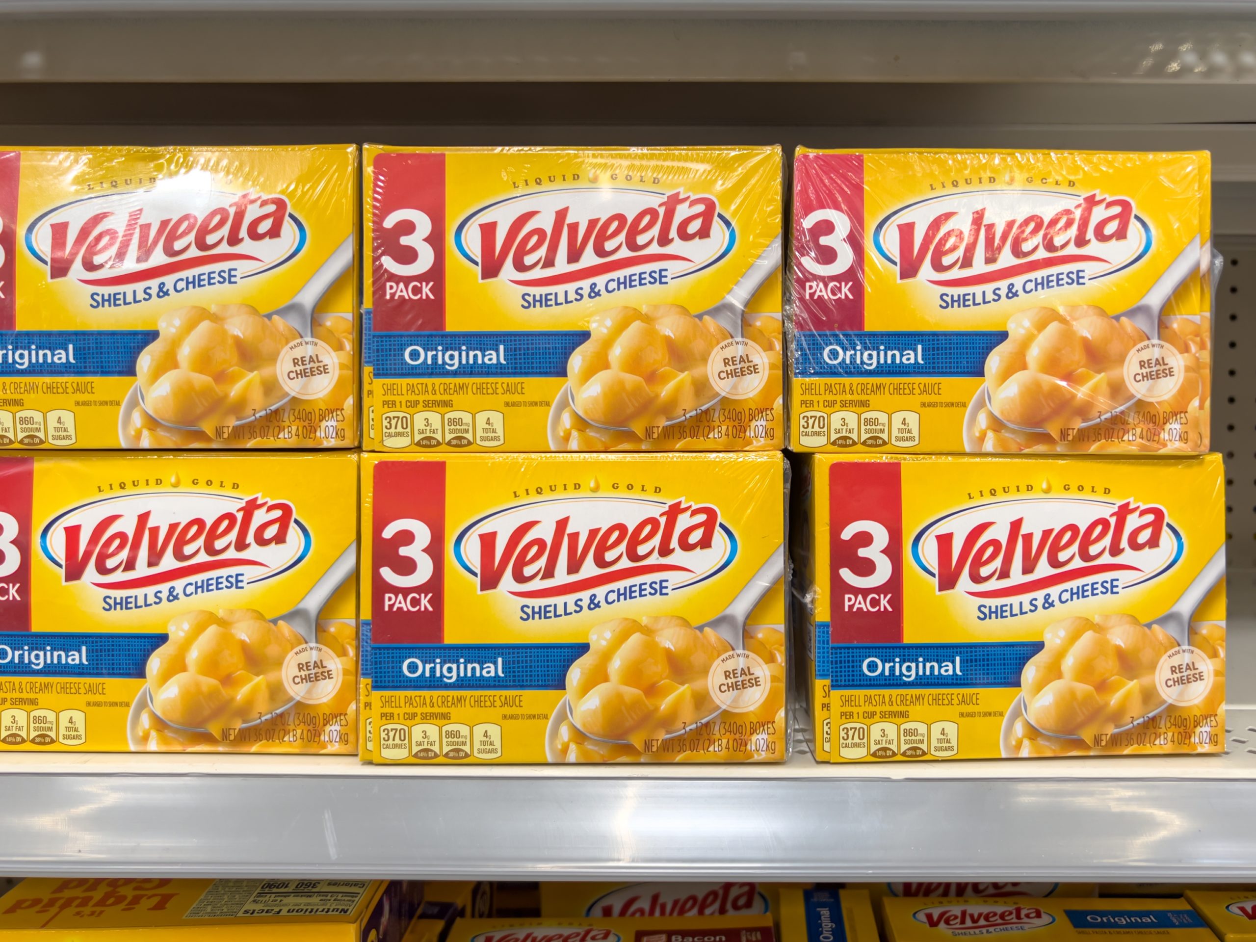 Velveeta Shells and Cheese Original Shell Pasta and Cheese Sauce Meal 3 ct Pack, 12 oz Boxes on the shelf in a grocery store.
