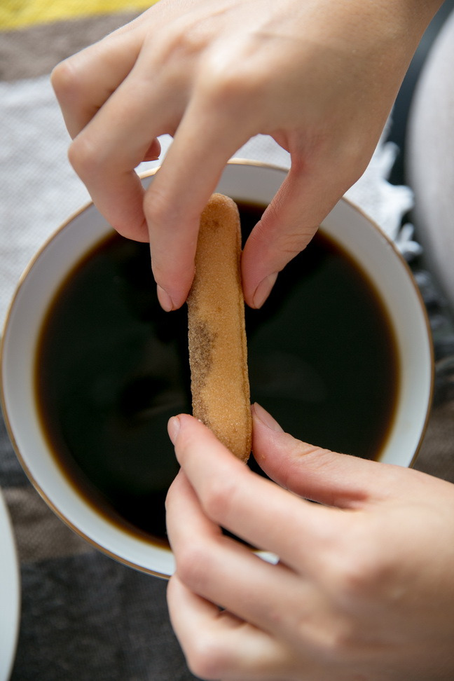 classic-tiramisu-dipping-cookies-into-coffee